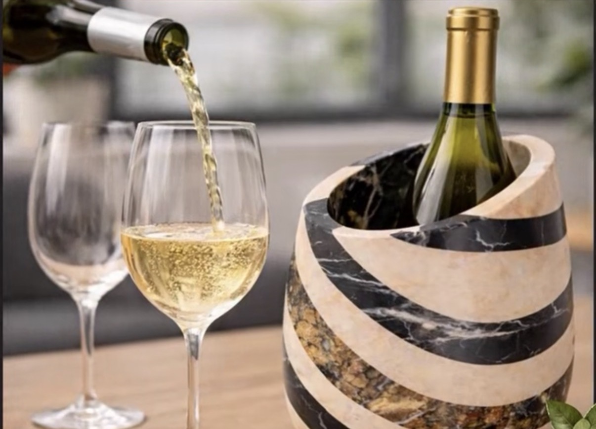 Spiral marble and onyx wine chiller holding a bottle of white wine